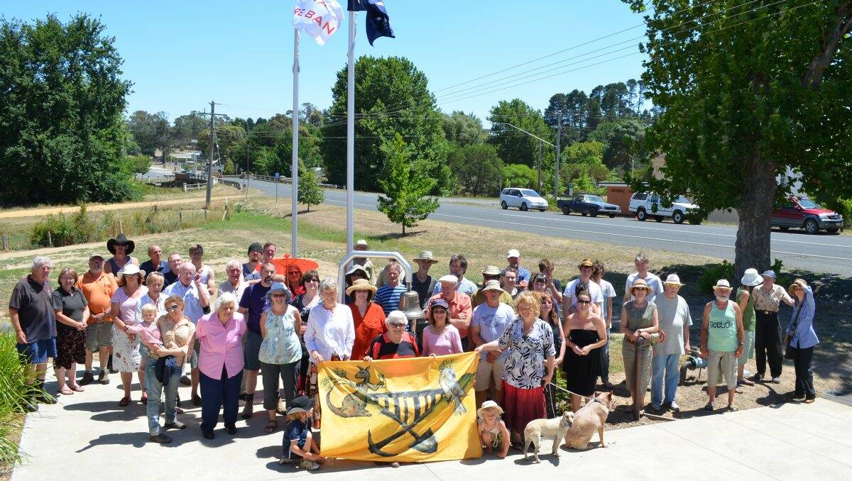UNITED: Taradale residents show off their new ‘People’s Republic of Taradale’ sign, at a meeting at the fire station earlier this month. Picture: MIDLAND EXPRESS