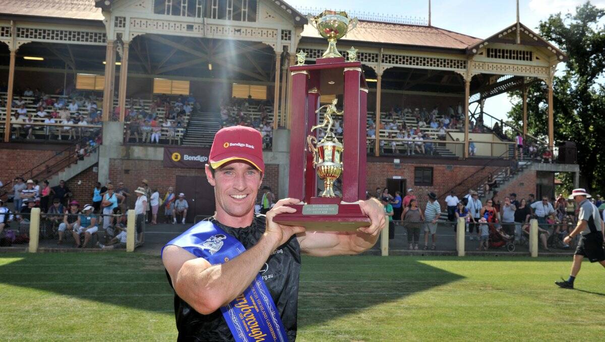 GLORY: Matthew Eddy holds the trophy after last year's Maryborough Gift victory at Princes Park. Picture: JIM ALDERSEY