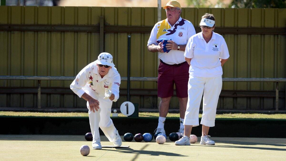 TEAM EFFORT: Blind bowler Ralph Simpson with his wife Jennifer Simpson in yesterday's play at Marong Bowls Club. Picture: JIM ALDERSEY