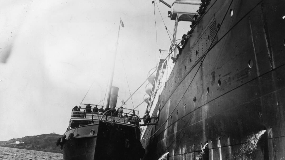 Survivors of the Titanic disaster boarding a tug from the liner which rescued them. Photo by Hulton Archive/Getty Images