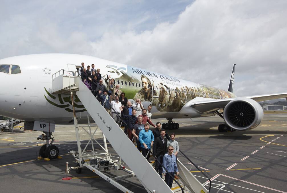 The cast and crew of 'The Hobbit: An Unexpected Journey', pose infront of an Air New Zealand Hobbit-inspired 777-300 in Wellington, New Zealand. Photo by Laura Forest/Air New Zealand via Getty Images