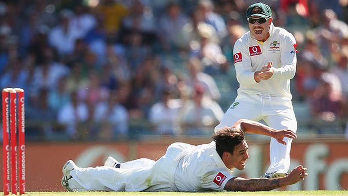 Johnson dives and gets his hands under the ball... Photo: Getty Images