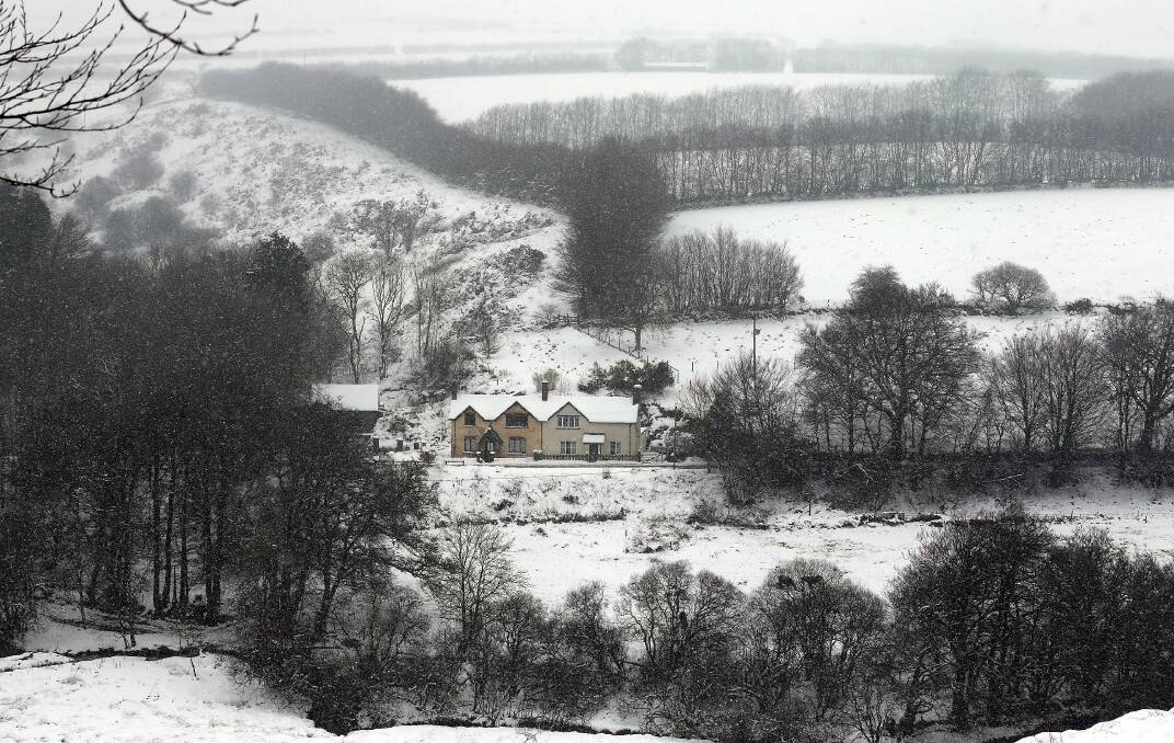 Snow covers fields near to Simonsbath at Exmoor, England. Photo by Matt Cardy/Getty Images
