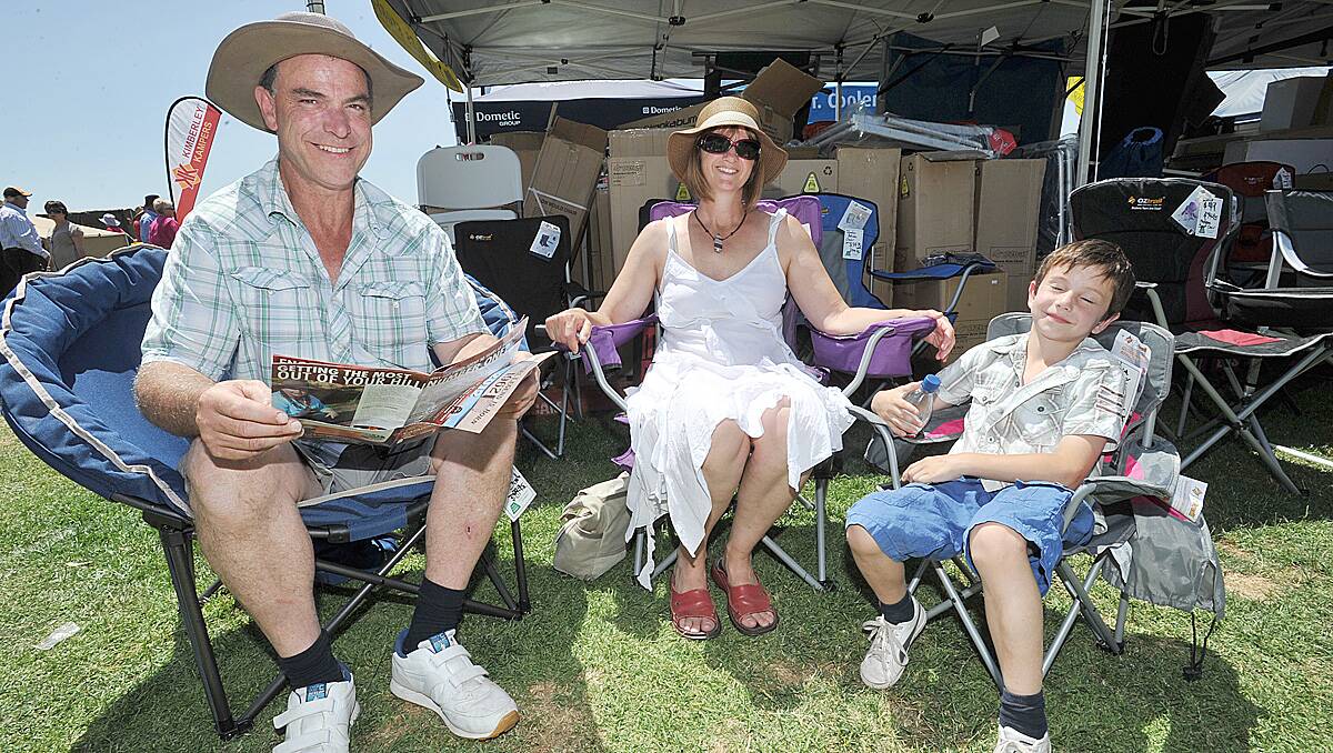 Chris and Cheryl Carroll along with their son Peter try out the variety of camping chairs on the Lyal Eales stand
