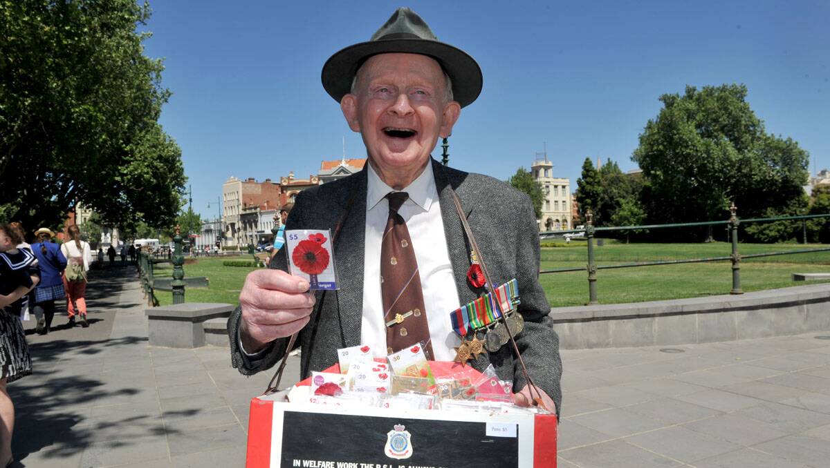 Norm Smart selling poppies for Remembrance Day. Picture: Julie Hough