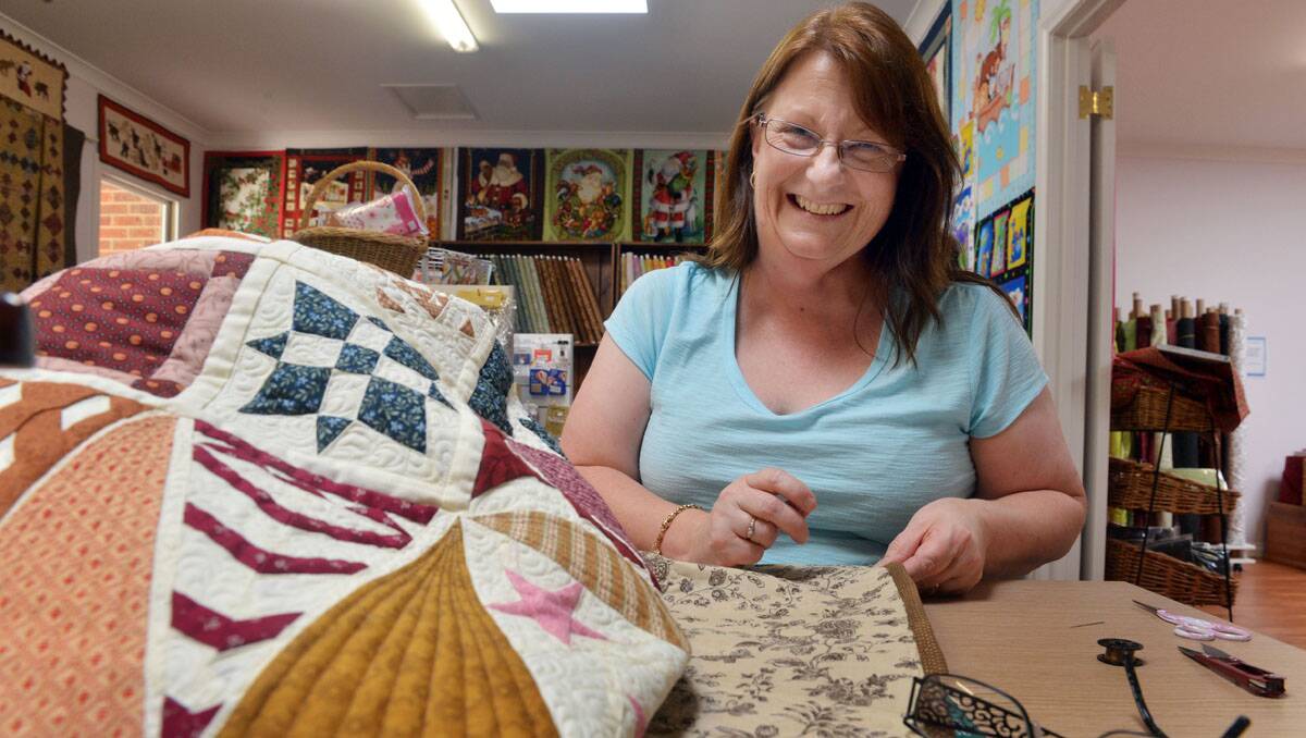 Alison puts the finishing touches on her Dear Jane quilt. Picture: Brendan McCarthy