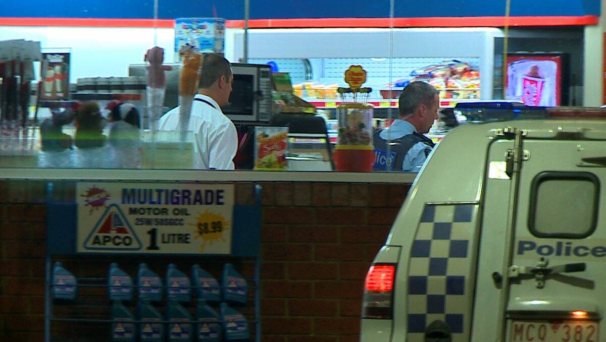 HELD UP: Police at the scene of Monday night’s robbery at the Apco service station in High Street, Kangaroo Flat. Picture: APEX IMAGERY