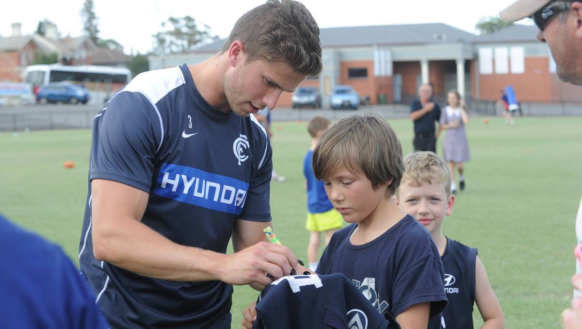 Carlton super clinic at the QEO. Marc Murphy with fan Lachlan Nemet. Picture: Jodie Donnellan