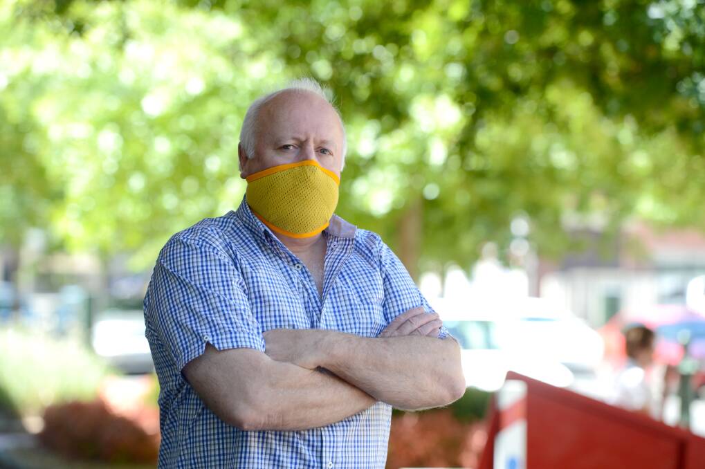 Mike Taylor and his breathing mask he wants supplied to Firefighters called "Fair Air".