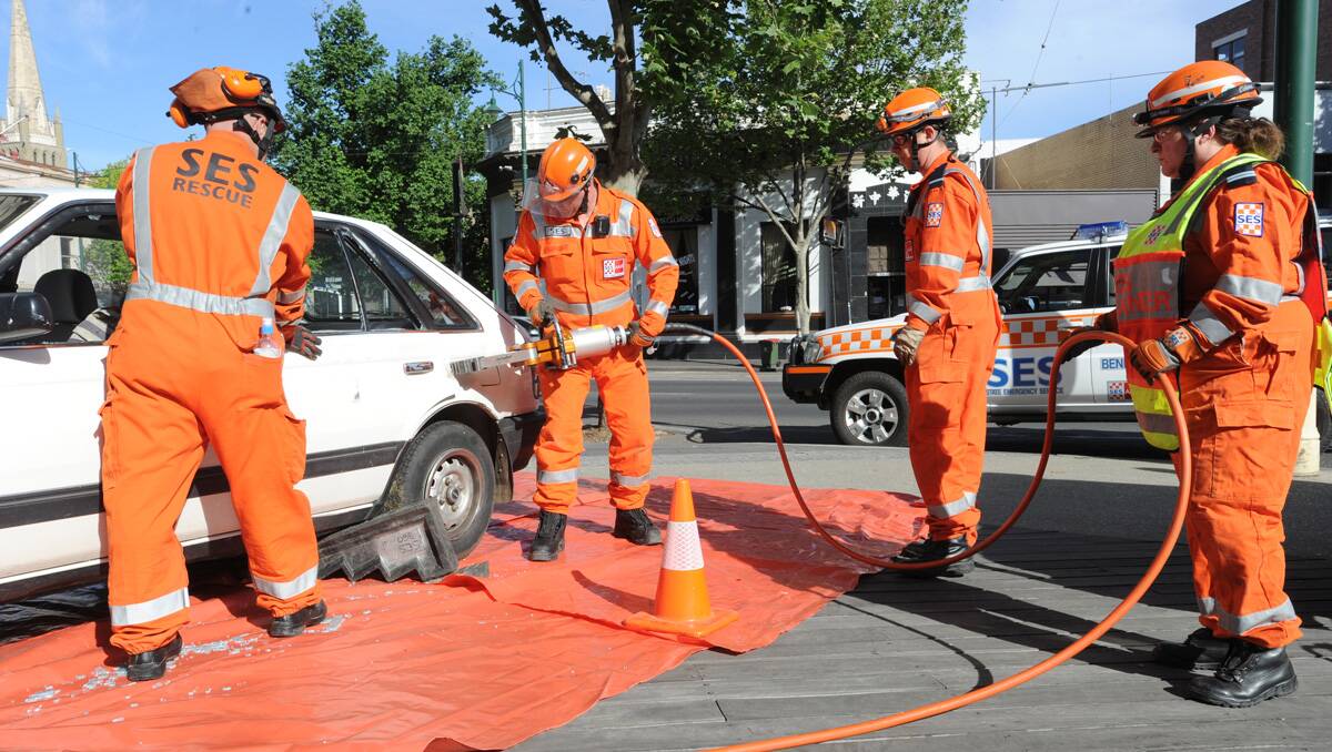 SES crews perform a demonstration this morning. Picture: Peter Weaving