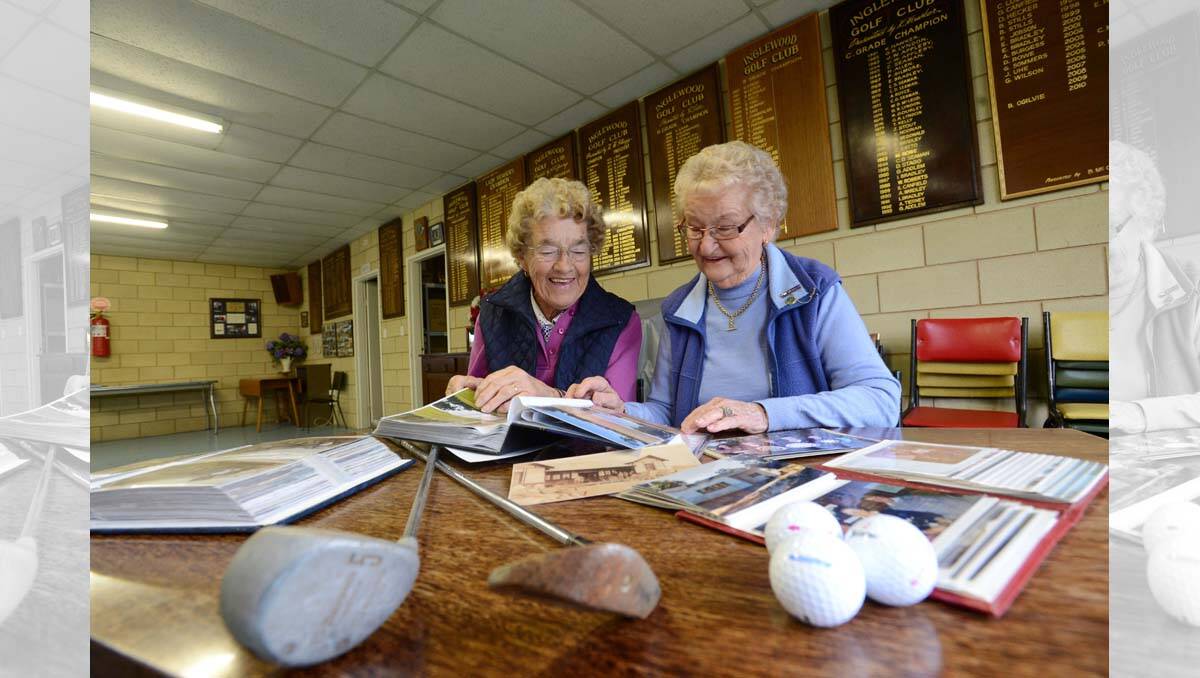 Inglewood Golf Club ladies Captain Daphne Chamberlain and ladies President Estelle Wilson in the Inglewood Golf Club clubrooms looking over some old photos. Picture Jim Aldersey
