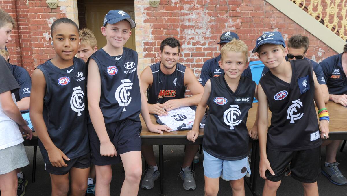 Carlton super clinic at the QEO. Fans Matt Floyd, Jacob Floyd, Billy Quirk and Max Shanahan wait to get autograhs from players. Picture: Jodie Donnellan