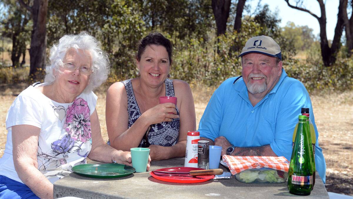 Elaine Saunder, from Melbourne, with Lockwood South residents Jenna and Ron Abbott at Lake Eppalock. Picture: Jim Aldersey