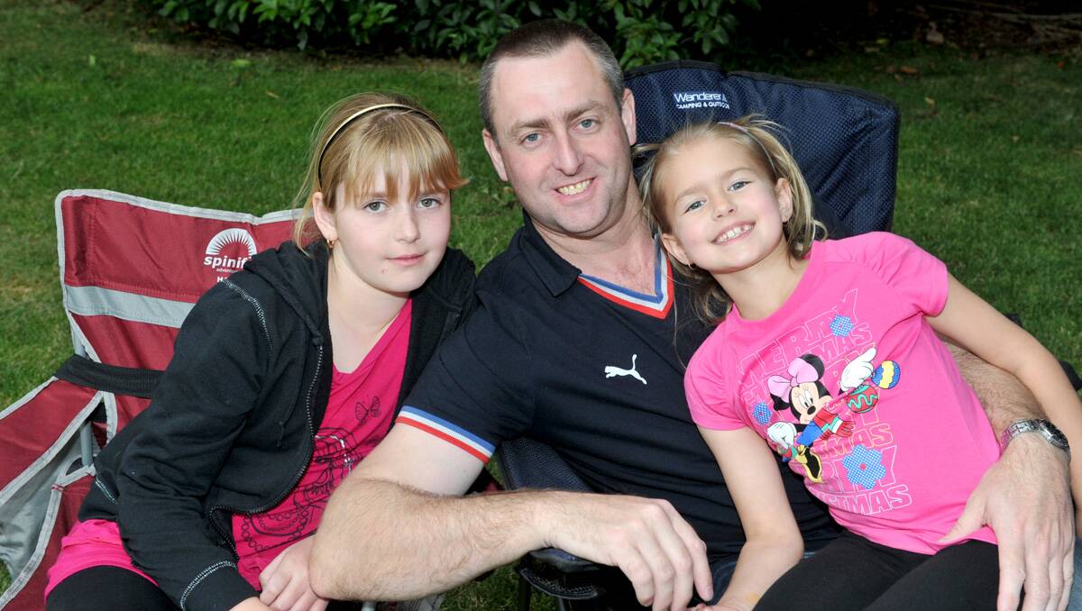 Zoe and Kayla with dad Rob Marsh. Picture: Jodie Donnellan