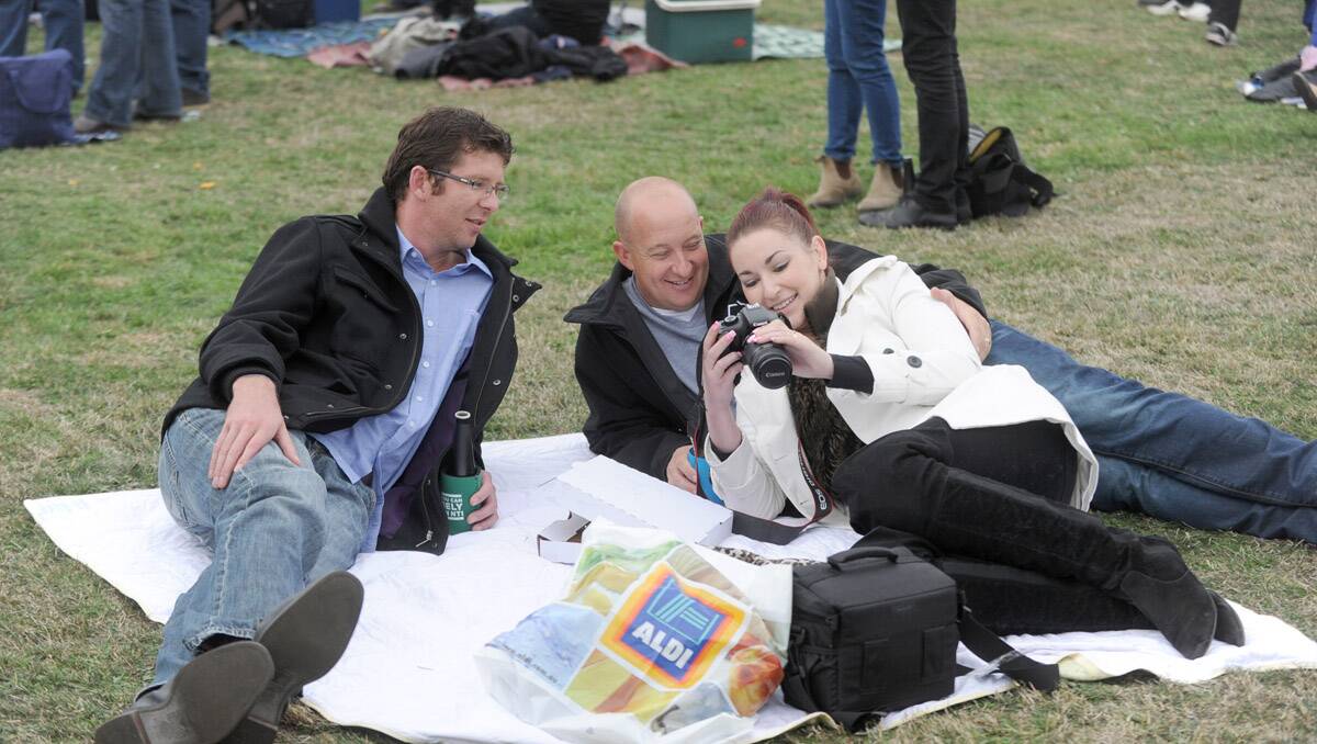 Bruce Springsteen and the E-Street Band perform at Hanging Rock. Adrian Galvin with Steven and Danielle Olver. Picture: Jodie Donnellan