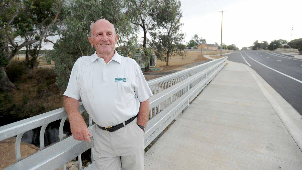 IMPRESSED: Resident Roy Wilkinson on the recently finished bridge in Kangaroo Flat. Picture: JODIE DONNELLAN
