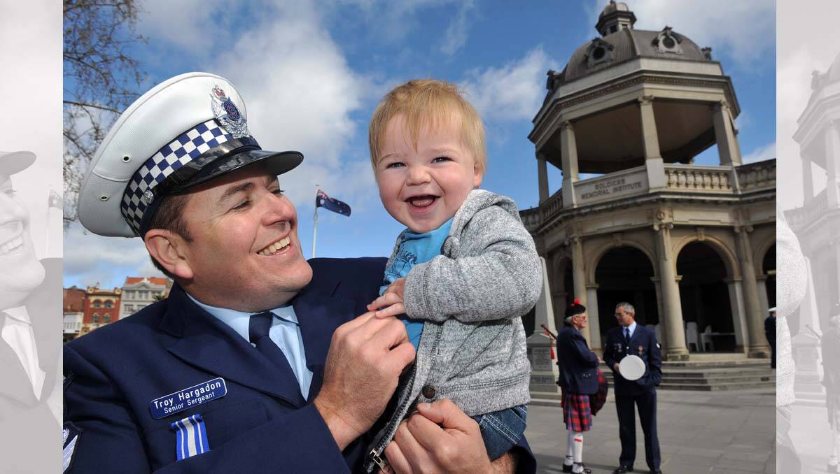 Police Remembrance Day. Senior Sergeant Troy Hargadon with his nephew Alby Hargadon. Picture: Julie Hough
