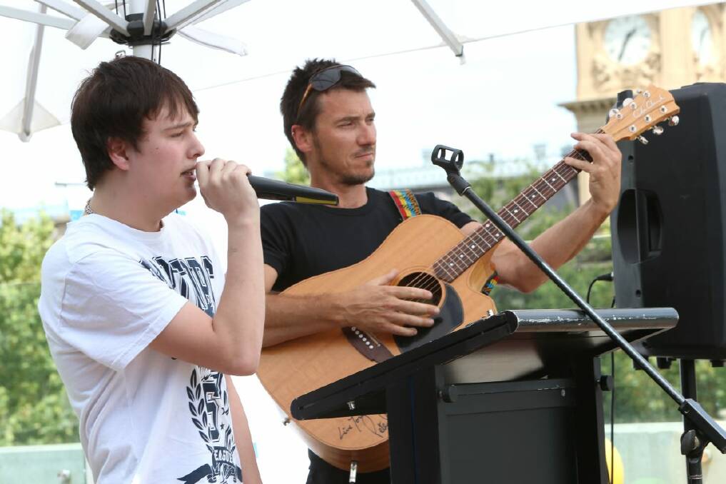 TALENTED: Below: Nathan Gorrie performs a song he wrote with youth worker Wayne Glenn.