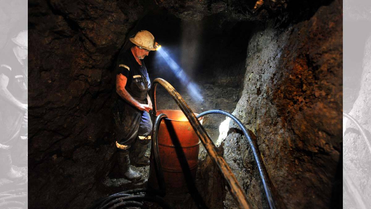 Miner Steve Johns 40 metres down a mine shaft. Picture: Peter Weaving
