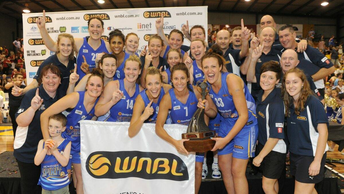 THE REAL DEAL: The Bendigo Spirit celebrate with the WNBL trophy after their convincing win over Townsville yesterday. Picture: JODIE DONNELLAN 