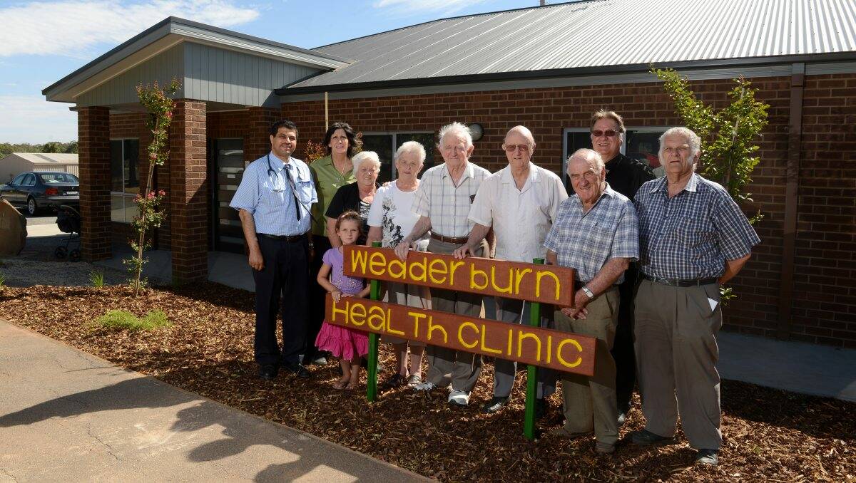 COLLABORATION: Dr Shaker Issa, receptionist Maree Postle, Libby, 5, with Korong Hospital Investment Fund committee members Shirley Smith, Ruth Norman, Ted Hargreaves, Campbell Holmes and Ray Tonkin,  IDHS chief executive Michael Parker and president Peter Norman. Picture: JIM ALDERSEY	