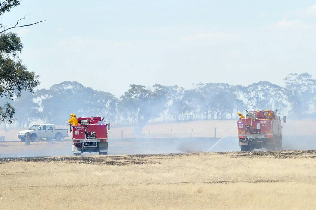 Crews respond to a grass fire at Triangle Road, Bridgewater. Picture: JODIE DONNELLAN