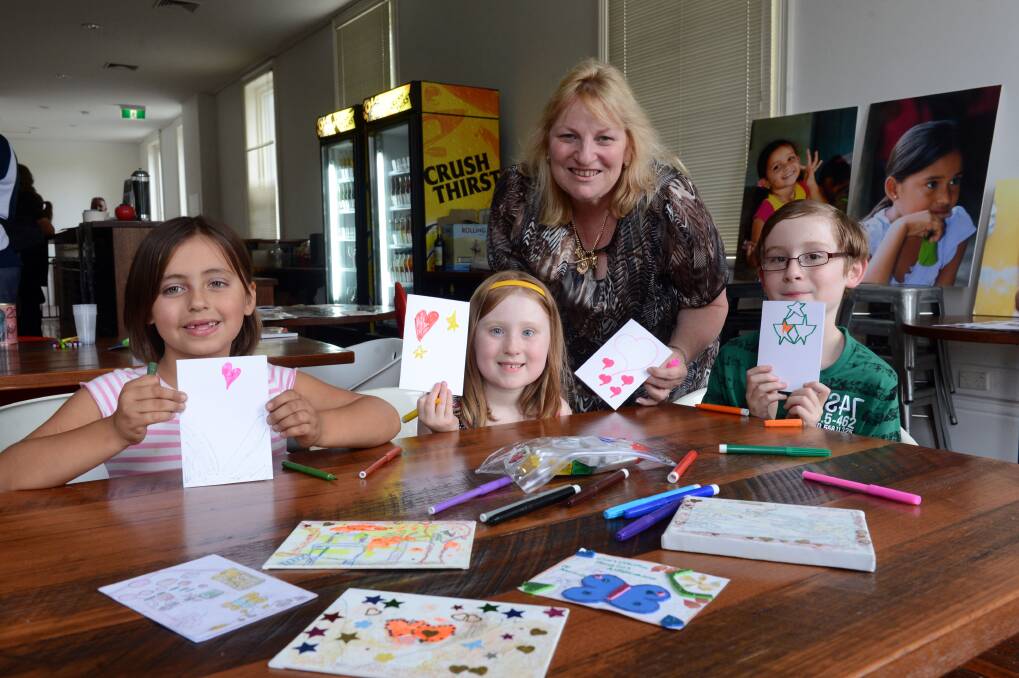 MESSAGE: Amelia Hammond, 7, Violet Griffiths, 6, and Connor Griffiths, 8, with mayor Lisa Ruffell. Picture: JIM ALDERSEY