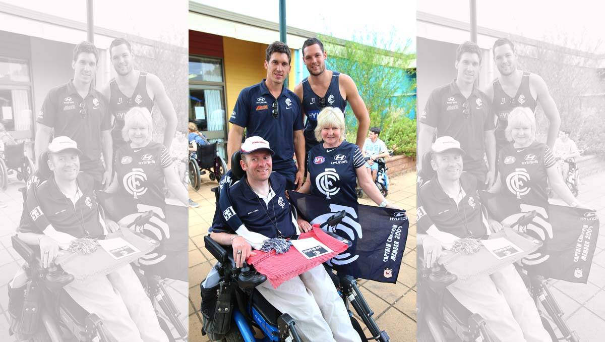Carlton tragics Client Ross Martins and support worker Deb Bourke with Michael Jamison and Rob Warnock. Picture: Peter Weaving