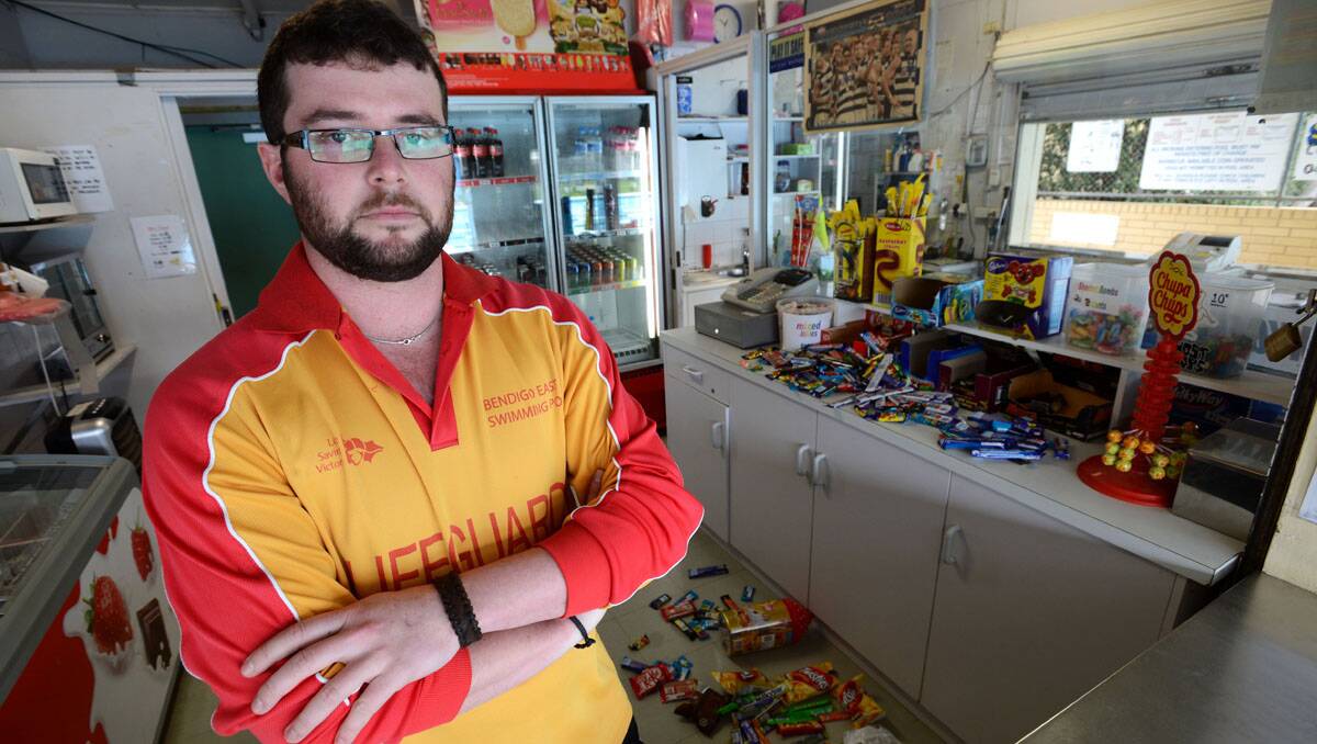 Lifeguard Michael Besley. Thieves broke into the Bendigo East swimming pool overnight and loaded up a plastic bag of lollies. They left the bag and fled, this is the second time in recent weeks that this has happened.  Picture: Jim Aldersey