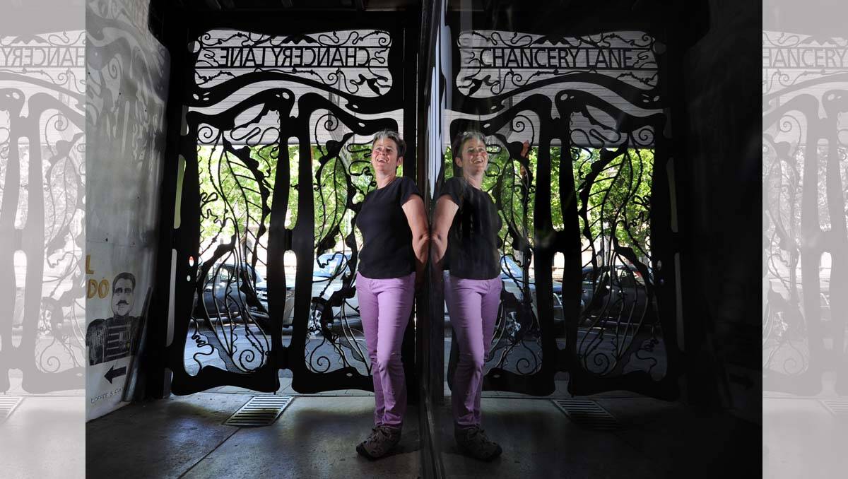 Artist Yvonne George and her new Chancery Lane gates. Picture: Peter Weaving