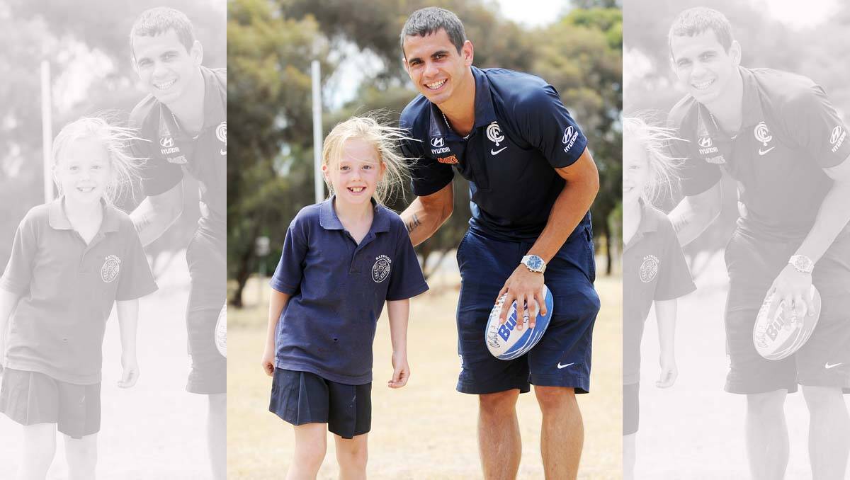 Carlton players visit Raywood Primary School. Jeff Garlett with Sharnie Atherton. Picture: Jodie Donnellan