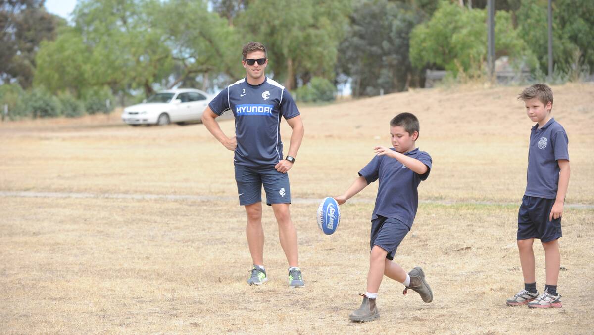 Carlton players visit Raywood Primary School. Marc Murphy with Tommy Atherton. Picture: Jodie Donnellan