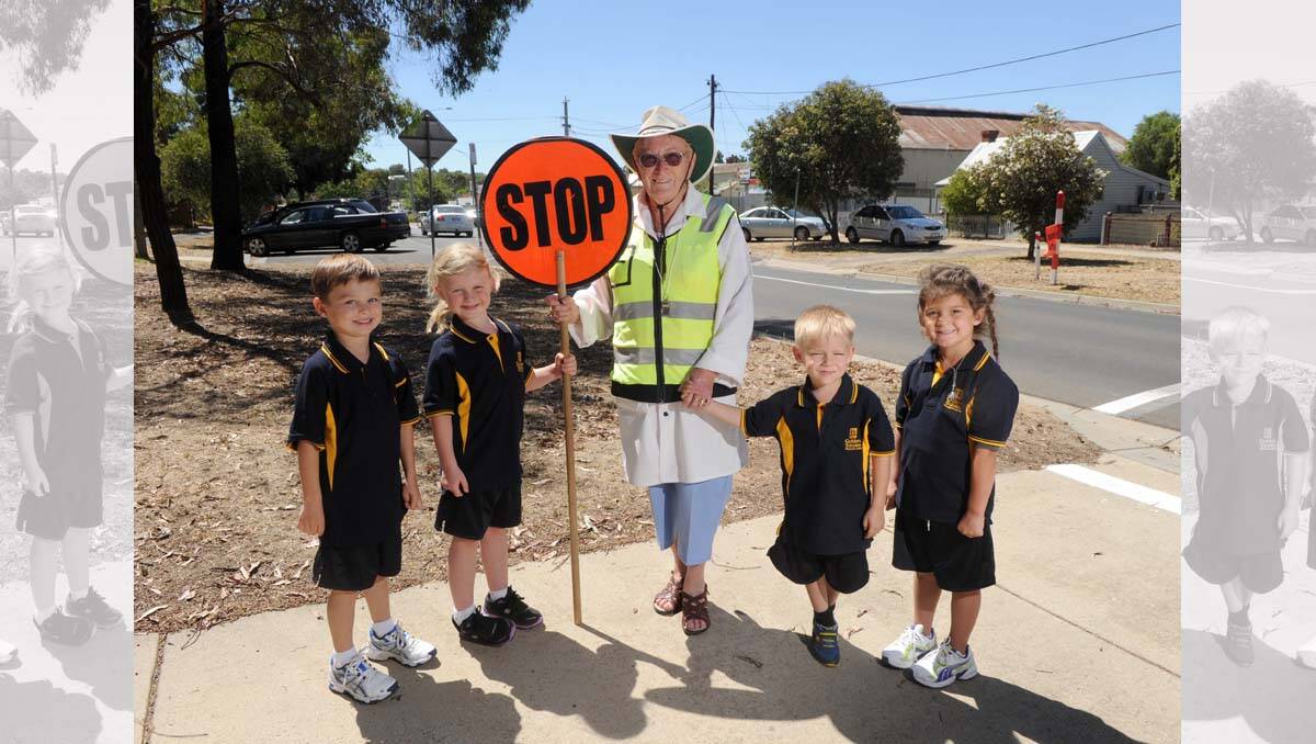 Golden Square Primary School prep students Connor, Abby, Tye and Ruby with crossing supervisor Margaret Hill. Picture: Jodie Donnellan