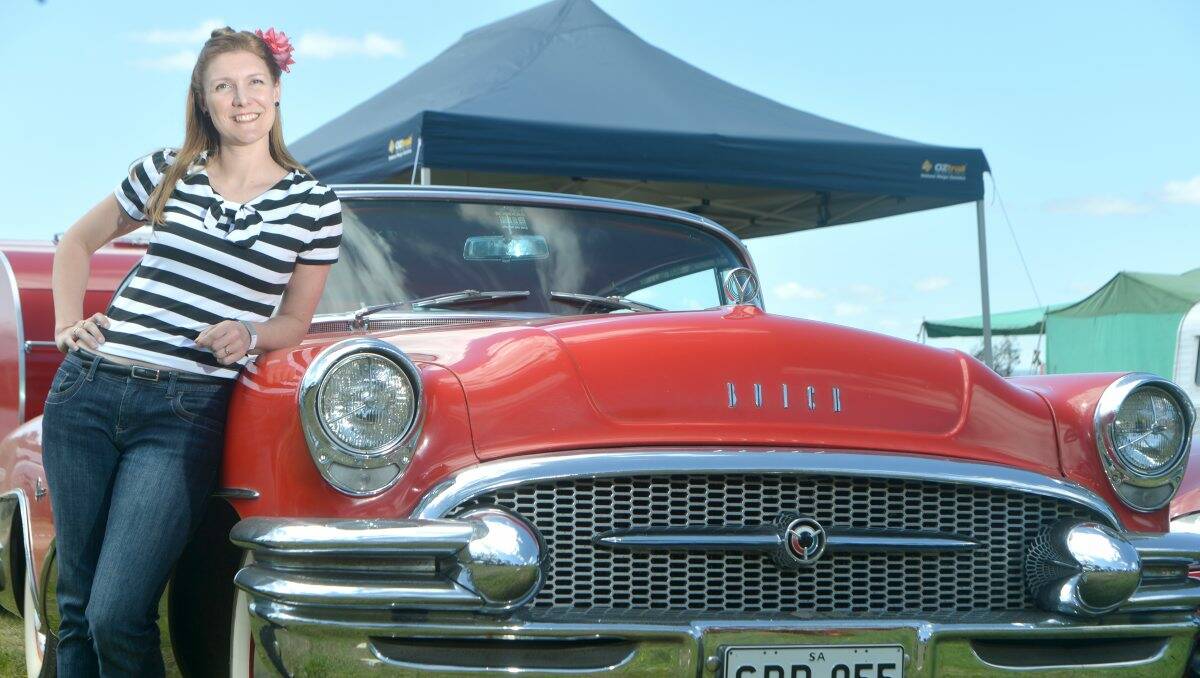 DRAWCARD: At the Chopped Rod & Custom festival on Friday, Carly Dale with a Red 1955 Buick Super. Picture: Blair Thomson