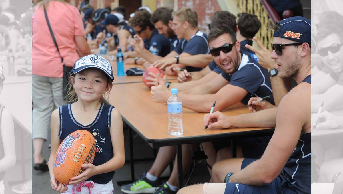 Carlton super clinic at the QEO. Fan Haylee Jack gets autograhs from players. Picture: Jodie Donnellan