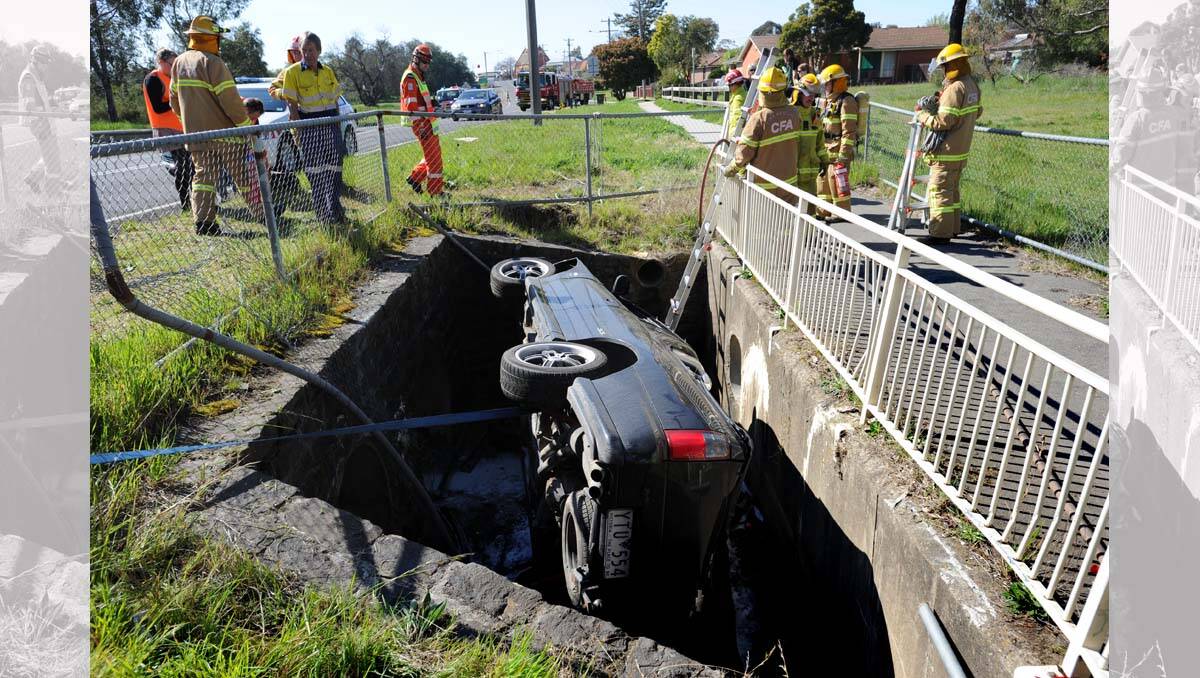 A ute ended up in a drain on Sparrowhawk Road, Long Gully. Picture: Peter Weaving