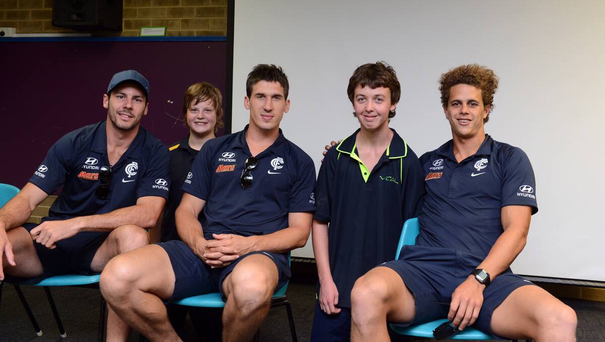 Kaliana students Tyler and George with Carlton Footballers Simon White, Michael Jamison and Ed Curnow. Picture: Jim Aldersey