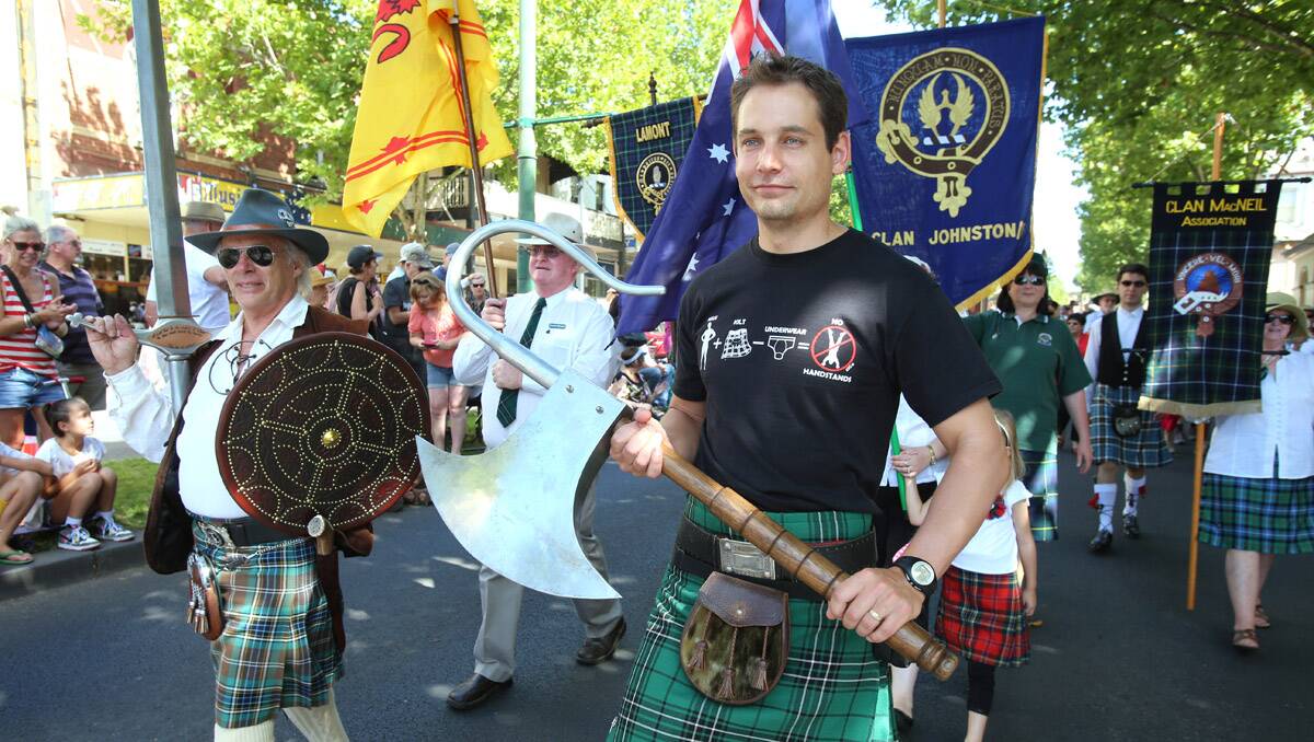 Bendigo's first Scots Day Out event kicks off with a march down View Street. Paul MacLean carring the Lochaber Axe. Picture: Peter Weaving
