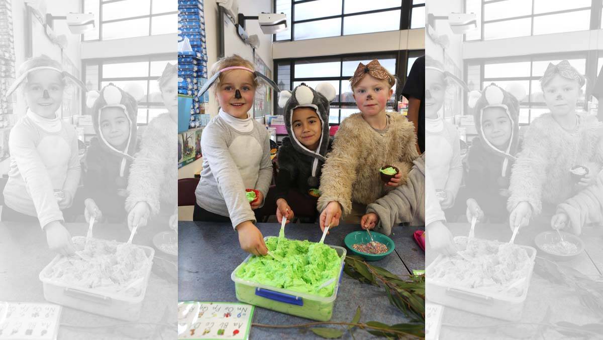 Camp Hill PS with Preps at their 100 days party day. Emily Edwards, Sage Wall and Seren Smith ice their cakes. Picture Peter Weaving