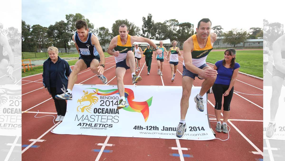 Launch of the Oceania Masters Games. Jumping the banner are hurdlers Tracy Willson, Leigh Browell and Dave Chisholm. Picture: Peter Weaving