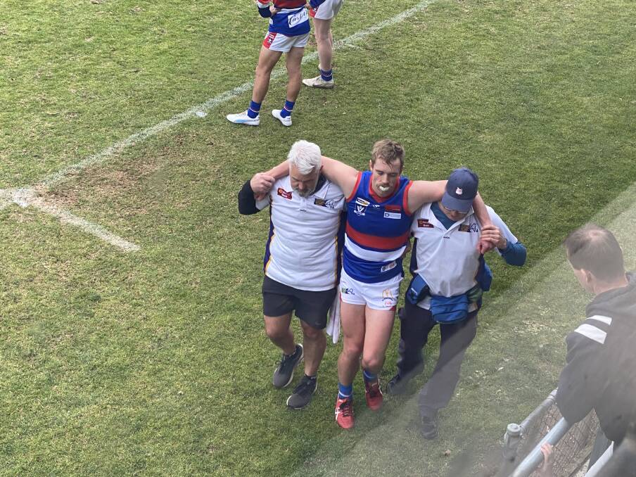 Pat McKenna exits the field at Wade Street in round six 2023 after sustaining a season ending ankle injury. 