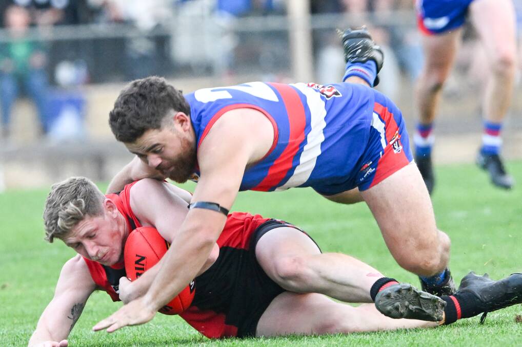 White Hills co-coach Kaiden Antonowicz and North Bendigo's Manny Thalasinos during Saturday's HDFNL match of the round. Picture by Darren Howe