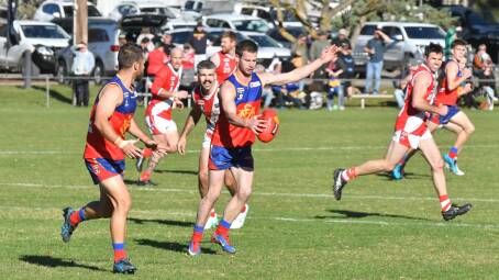 Marong's Nathan Devanny works the ball off half-back in the Panthers' win over Bridgewater on Saturday. Picture by Adam Bourke