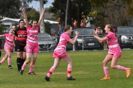 Spring Gully players celebrate a goal from Letesha Bawden which put the Reds on track for victory in the League Cup Women's semi-final. Picture by Adam Bourke